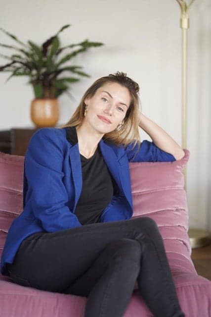 Portrait of psychologist Diane Mesnier seated in a blue blazer